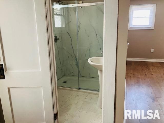 6 S Division St, Duquoin, IL 62832 - bathroom featuring a marble finish shower and wood finished floors