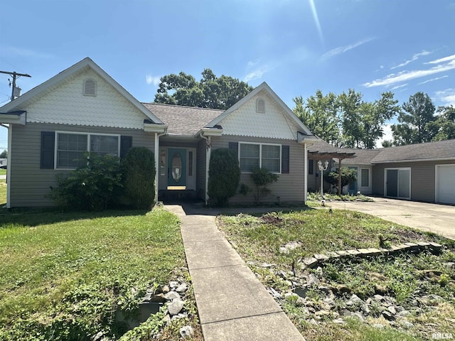 104 Mcneil St, Energy, IL 62933 - view of front of house featuring a front lawn, concrete driveway, and a garage