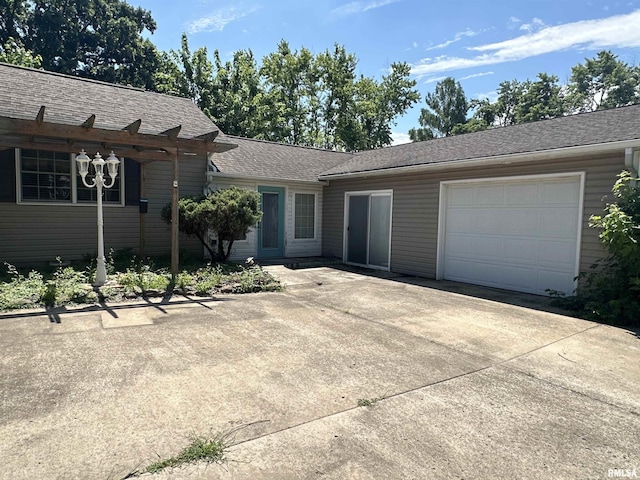 104 Mcneil St, Energy, IL 62933 - ranch-style home featuring an attached garage, driveway, and a shingled roof