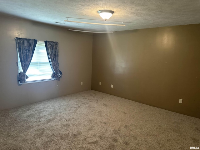 104 Mcneil St, Energy, IL 62933 - unfurnished room featuring carpet floors and a textured ceiling
