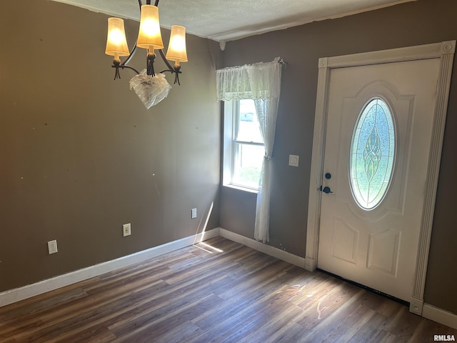 104 Mcneil St, Energy, IL 62933 - entrance foyer featuring a chandelier, wood finished floors, a textured ceiling, and crown molding