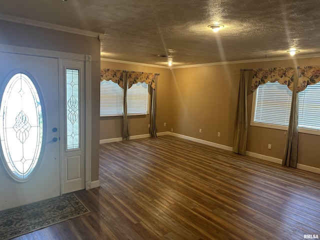 104 Mcneil St, Energy, IL 62933 - foyer featuring dark wood finished floors, ornamental molding, and a textured ceiling