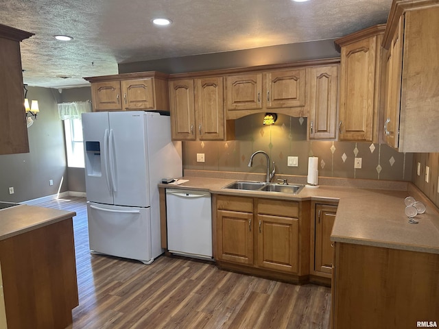 104 Mcneil St, Energy, IL 62933 - kitchen featuring white appliances, dark wood-style floors, brown cabinets, recessed lighting, and a textured ceiling