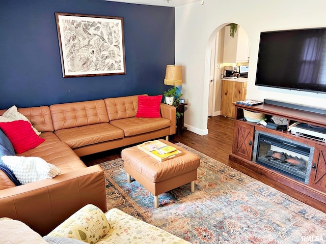 803 Butler St, Metropolis, IL 62960 - living room featuring wood finished floors and arched walkways