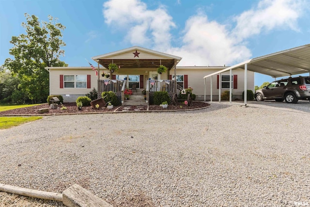 11149 Crenshaw Rd, Marion, IL 62922 - view of front of home with gravel driveway, covered porch, and a carport