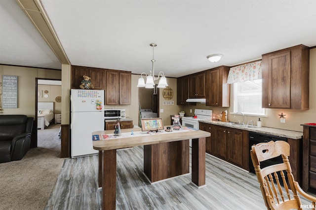 11149 Crenshaw Rd, Marion, IL 62922 - kitchen featuring white appliances, light wood-style flooring, pendant lighting, under cabinet range hood, and dark brown cabinets