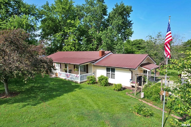 4139 Altenberger Rd, Metropolis, IL 62960 - view of front of home featuring a porch, a front yard, a metal roof, and a chimney