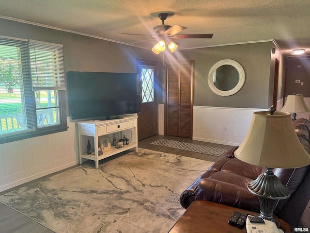 4139 Altenberger Rd, Metropolis, IL 62960 - living area featuring ornamental molding, ceiling fan, wood finished floors, a textured ceiling, and wainscoting