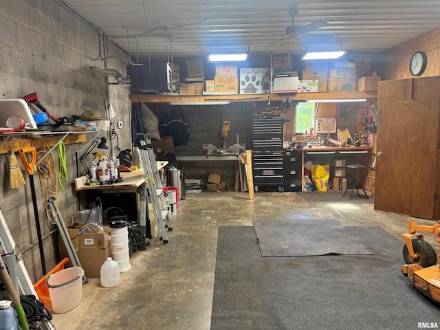 4139 Altenberger Rd, Metropolis, IL 62960 - garage with a workshop area, concrete block wall, and ceiling fan