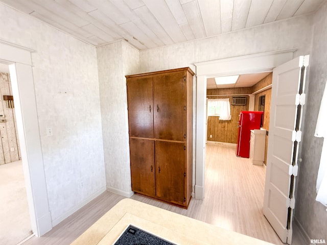 202 Flora Ave, Flora, IL 62839 - corridor with wood finished floors and a wall mounted air conditioner