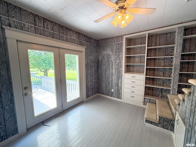 202 Flora Ave, Flora, IL 62839 - interior space with hardwood / wood-style floors, wooden walls, and ceiling fan