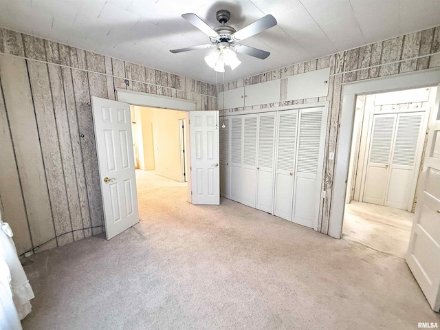 202 Flora Ave, Flora, IL 62839 - unfurnished bedroom with carpet flooring, a closet, and a ceiling fan