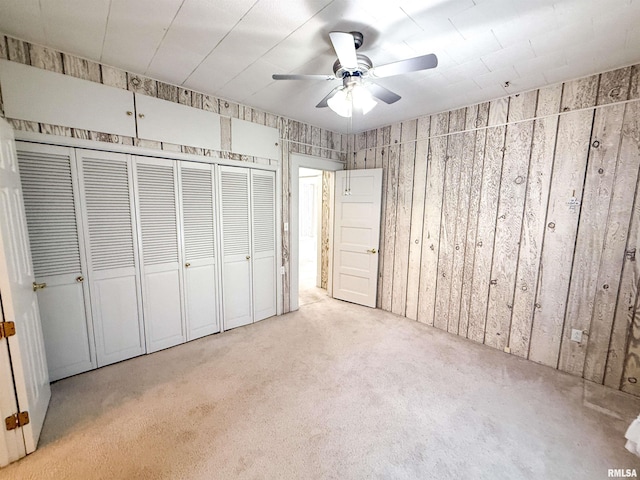202 Flora Ave, Flora, IL 62839 - unfurnished bedroom with carpet flooring, a closet, and a ceiling fan
