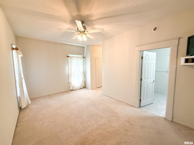 202 Flora Ave, Flora, IL 62839 - carpeted empty room featuring a ceiling fan and a textured ceiling