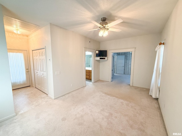 202 Flora Ave, Flora, IL 62839 - spare room featuring light colored carpet and a ceiling fan