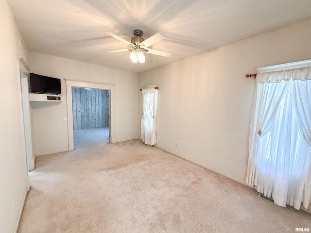 202 Flora Ave, Flora, IL 62839 - unfurnished room with light carpet and a ceiling fan