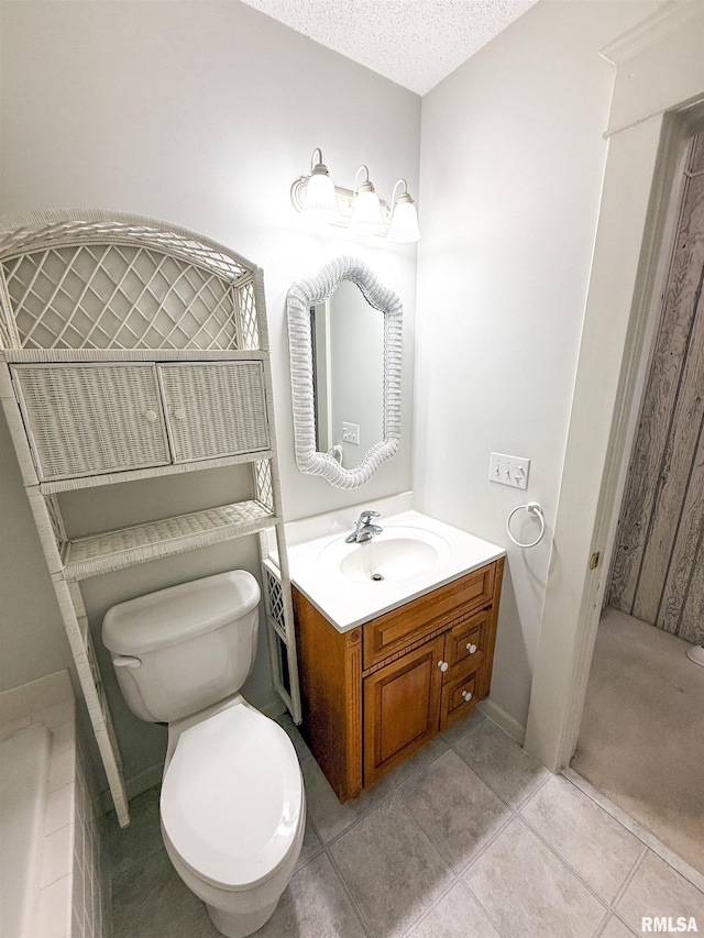 202 Flora Ave, Flora, IL 62839 - bathroom with vanity, tile patterned flooring, a bathtub, and a textured ceiling