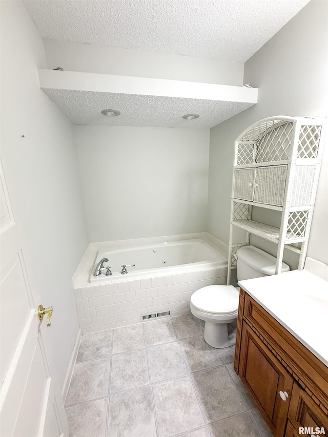 202 Flora Ave, Flora, IL 62839 - bathroom featuring a bath, a textured ceiling, vanity, and tile patterned flooring