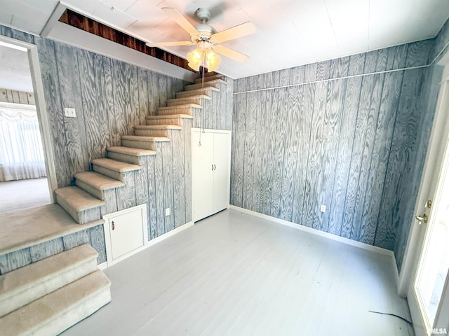 202 Flora Ave, Flora, IL 62839 - stairway featuring wood finished floors, a ceiling fan, and wallpapered walls