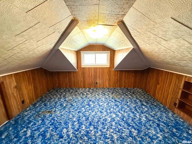 202 Flora Ave, Flora, IL 62839 - bonus room with wooden walls, lofted ceiling, and carpet