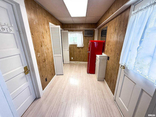 202 Flora Ave, Flora, IL 62839 - corridor with a wall mounted AC, light wood-type flooring, and wooden walls