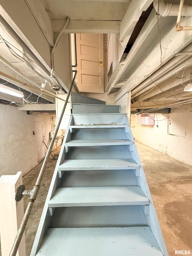 202 Flora Ave, Flora, IL 62839 - staircase with unfinished concrete floors