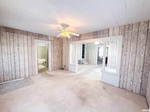 202 Flora Ave, Flora, IL 62839 - unfurnished room featuring a ceiling fan and decorative columns