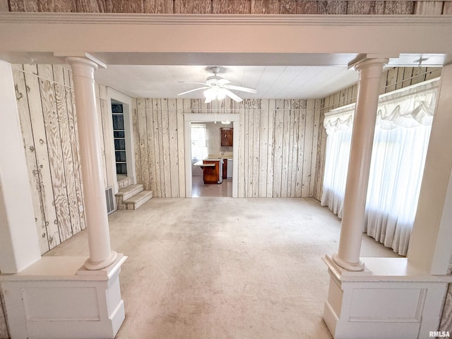 202 Flora Ave, Flora, IL 62839 - unfurnished living room with decorative columns, ceiling fan, and healthy amount of natural light