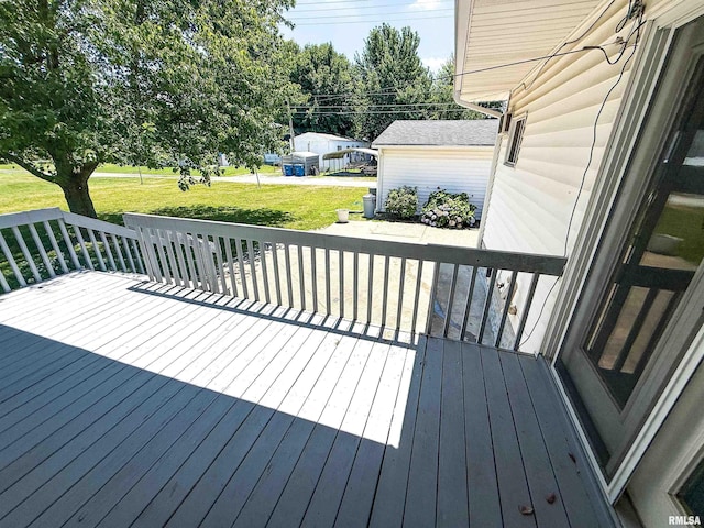 202 Flora Ave, Flora, IL 62839 - wooden terrace with a lawn