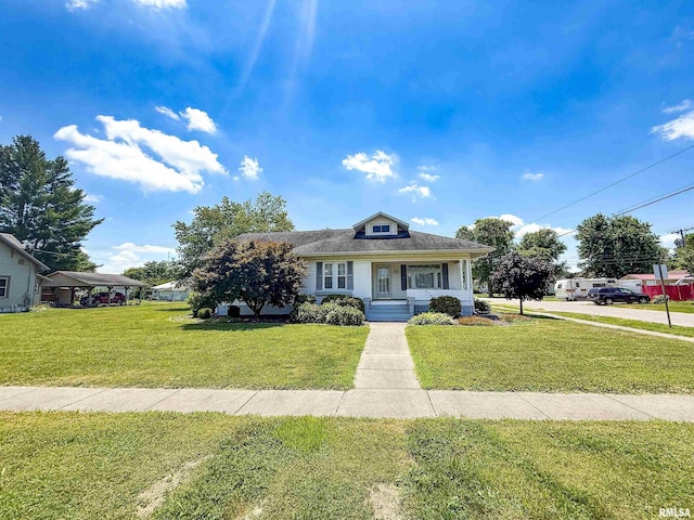 202 Flora Ave, Flora, IL 62839 - bungalow-style home with a front yard and a porch