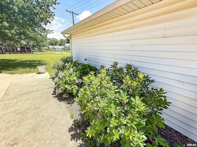 202 Flora Ave, Flora, IL 62839 - view of home's exterior with a yard and a patio area