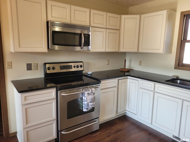11968 E Goshen Meadows Rd, Mount Vernon, IL 62864 - kitchen with stainless steel appliances, dark wood finished floors, and white cabinets