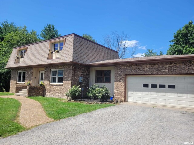 11968 E Goshen Meadows Rd, Mount Vernon, IL 62864 - view of front of house with brick siding, driveway, a shingled roof, and mansard roof