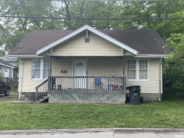 303 S Forest Ave, Carbondale, IL 62901 - view of front of property featuring covered porch, a front lawn, and a shingled roof