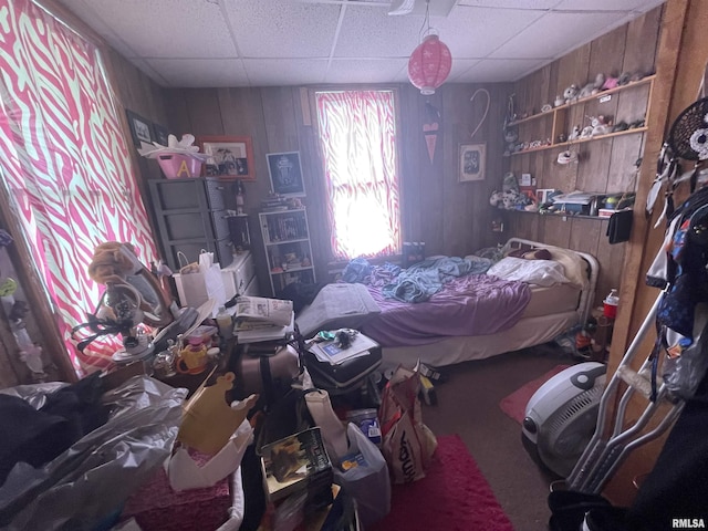 303 S Forest Ave, Carbondale, IL 62901 - carpeted bedroom with a paneled ceiling and wood walls