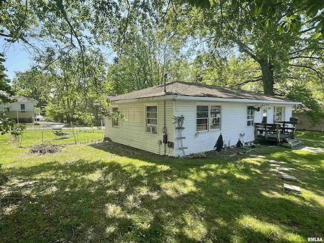 115 S Forest Ave, Carbondale, IL 62901 - view of property exterior with a yard, a deck, and view of scattered trees