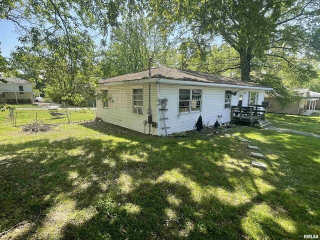 115 S Forest Ave, Carbondale, IL 62901 - view of property exterior with a yard and a deck
