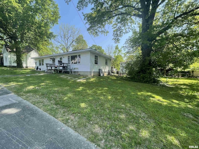 115 S Forest Ave, Carbondale, IL 62901 - view of side of property featuring a yard and a deck