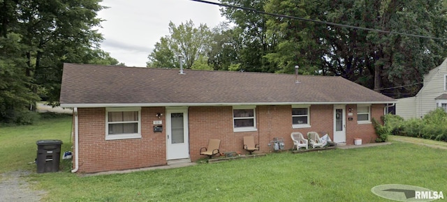 703 W High St, Carbondale, IL 62901 - single story home with brick siding, a front lawn, and a shingled roof