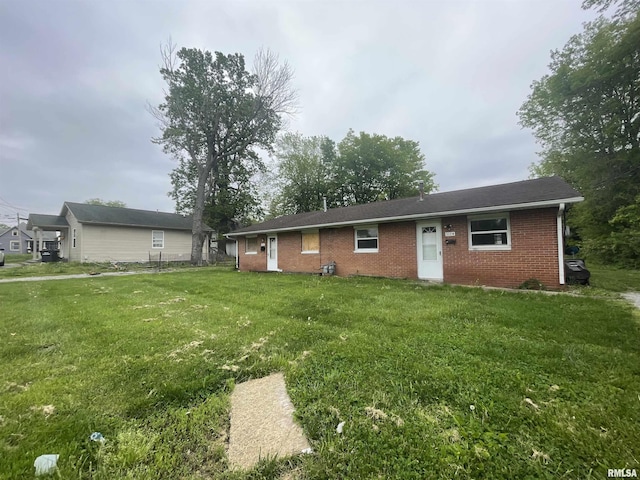 703 W High St, Carbondale, IL 62901 - view of front facade with brick siding and a front lawn