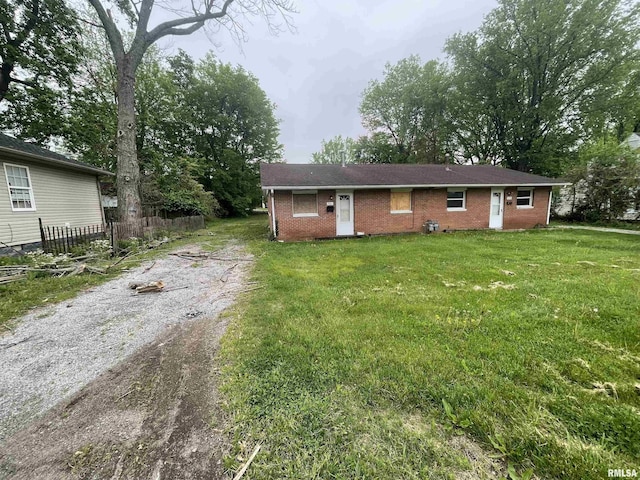 703 W High St, Carbondale, IL 62901 - view of front facade with brick siding and driveway