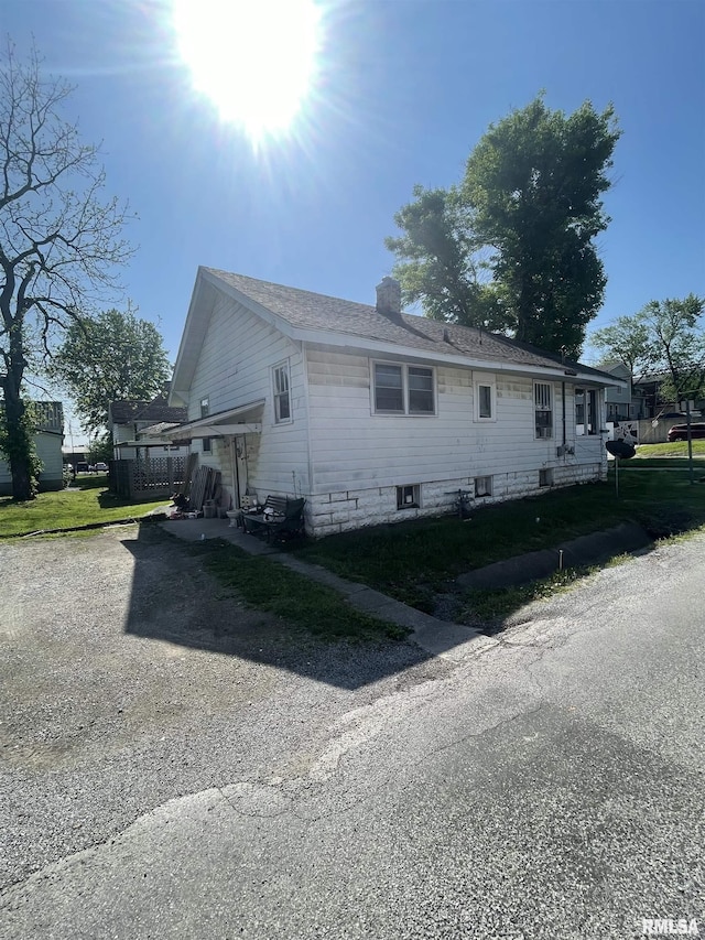 306 W Cherry St, Carbondale, IL 62901 - view of side of home featuring a chimney