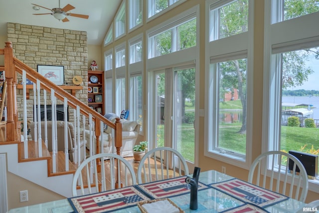 1382 Nicklaus Ln, Marion, IL 62959 - dining space with high vaulted ceiling, a ceiling fan, and a water view