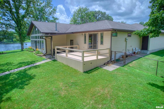 1382 Nicklaus Ln, Marion, IL 62959 - back of house with a fenced backyard, a water view, and roof with shingles