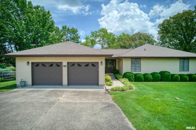 1382 Nicklaus Ln, Marion, IL 62959 - ranch-style home featuring concrete driveway, a front yard, a garage, and roof with shingles