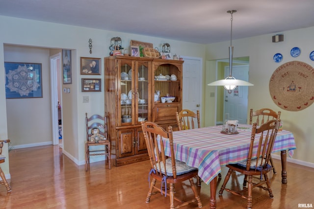 1382 Nicklaus Ln, Marion, IL 62959 - dining space with light wood-style flooring and baseboards