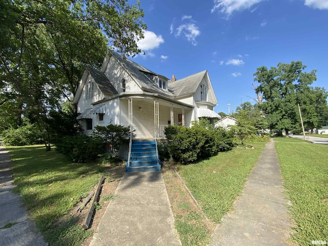 333 S Hickory St, Centralia, IL 62801 - view of front of home with a porch, a front lawn, and stairway