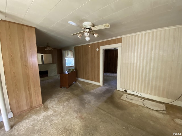 333 S Hickory St, Centralia, IL 62801 - unfurnished living room with wooden walls, carpet floors, a fireplace, and ceiling fan