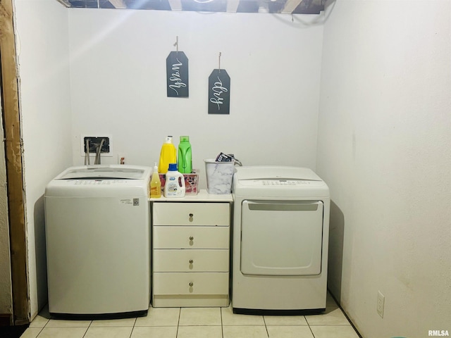 348 Medlin Rd, Walnut Hill, IL 62893 - laundry room featuring washing machine and dryer and light tile patterned flooring