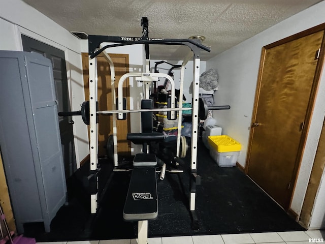 348 Medlin Rd, Walnut Hill, IL 62893 - workout area featuring a textured ceiling and tile patterned floors